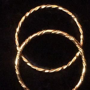 2 Heavy Gold Tone Bangles.